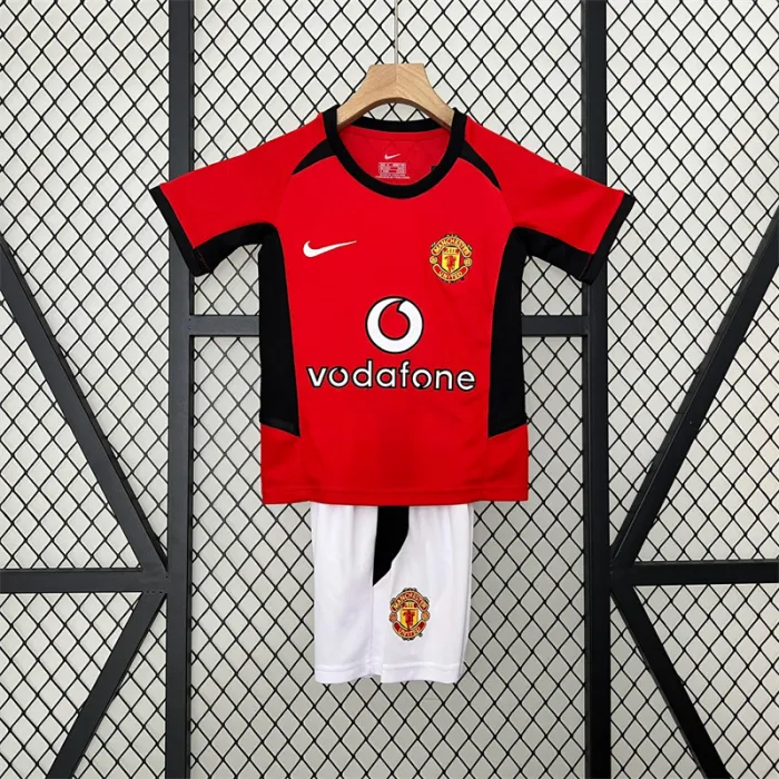 Camiseta retro de local del Manchester United para niños 02/04