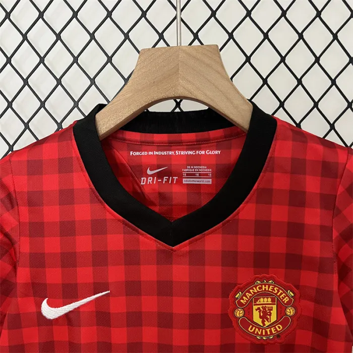 Camiseta retro de local del Manchester United para niños 12/13