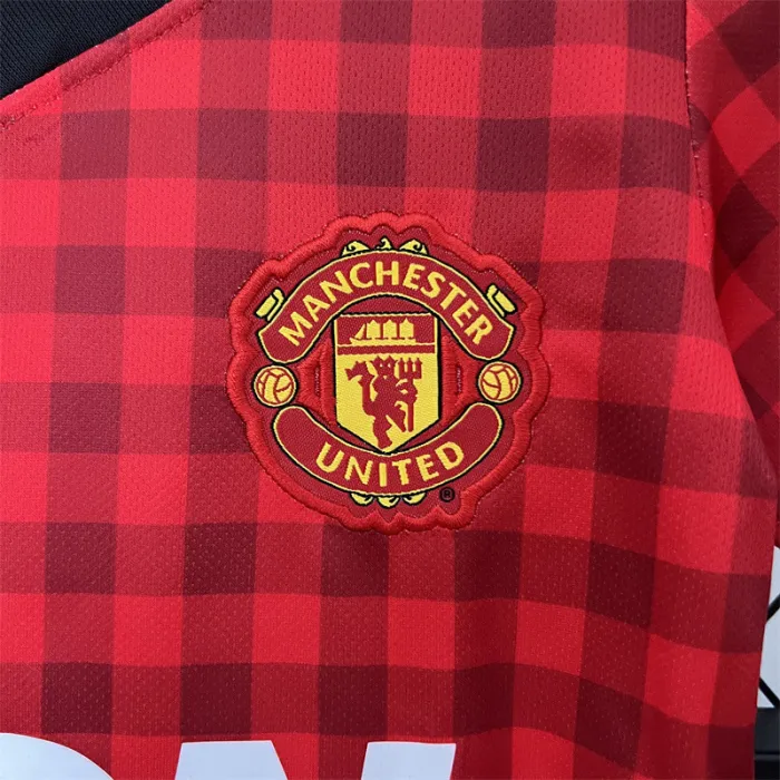 Camiseta retro de local del Manchester United para niños 12/13