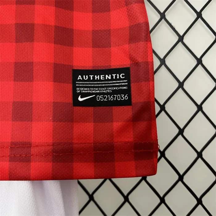 Camiseta retro de local del Manchester United para niños 12/13