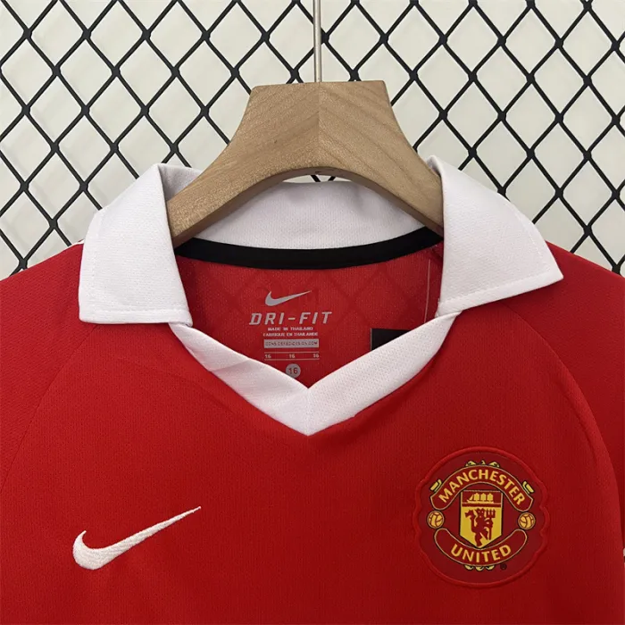 Camiseta retro de local del Manchester United para niños 10/11